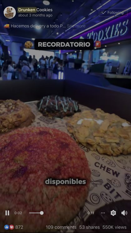 Drunken Cookies Facebook ad filmed inside a busy store with a box of cookies, showing 550 thousand views, 872 reactions, 109 comments and 53 shares